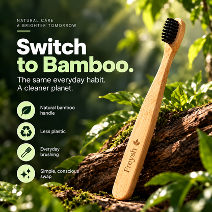 Freysh bamboo toothbrush with black bristles in a natural forest setting